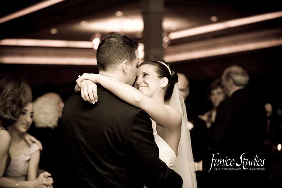 bride looks lovingly at groom during first dance