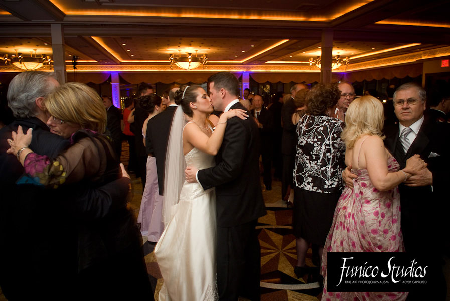 bride and groom kiss on dance floor at marina del rey bronx nyc